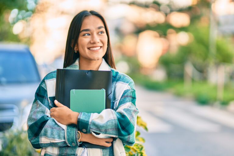 Smiling Woman Holding Books