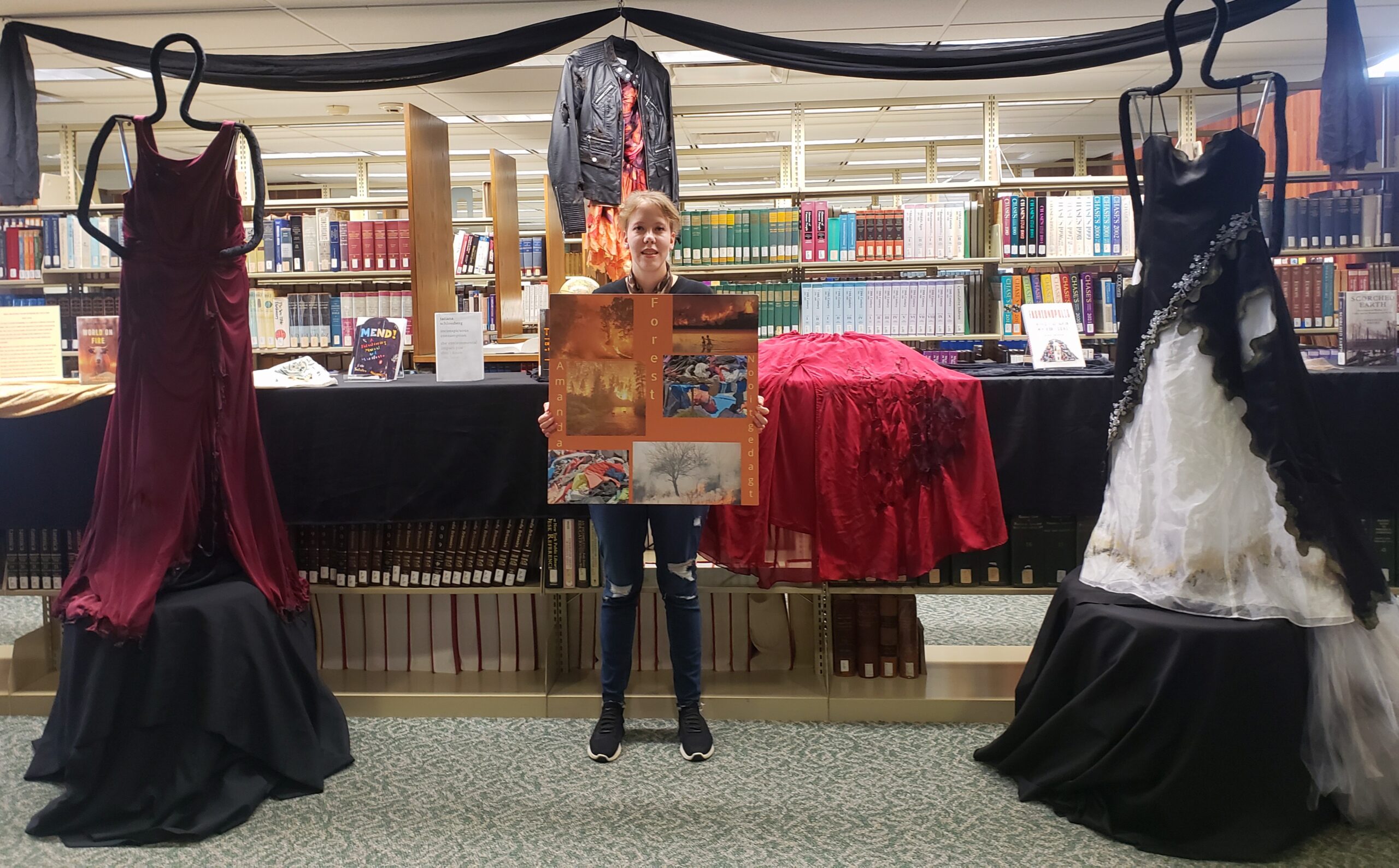 dresses and books on display at the library