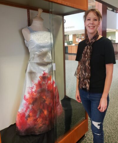 dresses and books on display at the library
