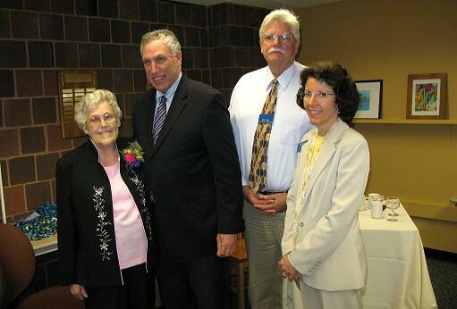 Betty Lane posing with colleagues upon retirement