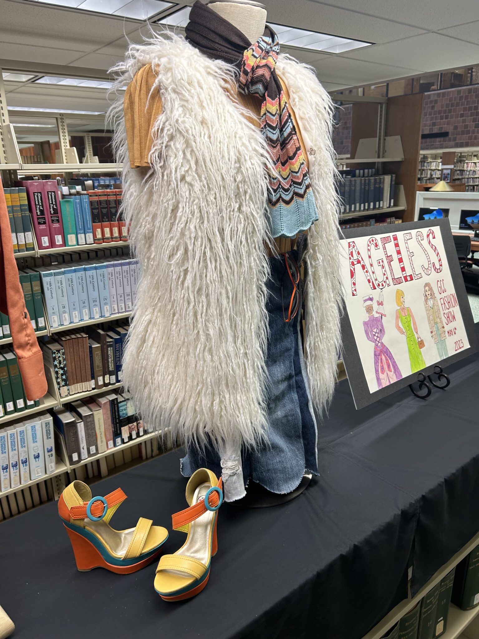 Fashion show display in library Genesee Community College