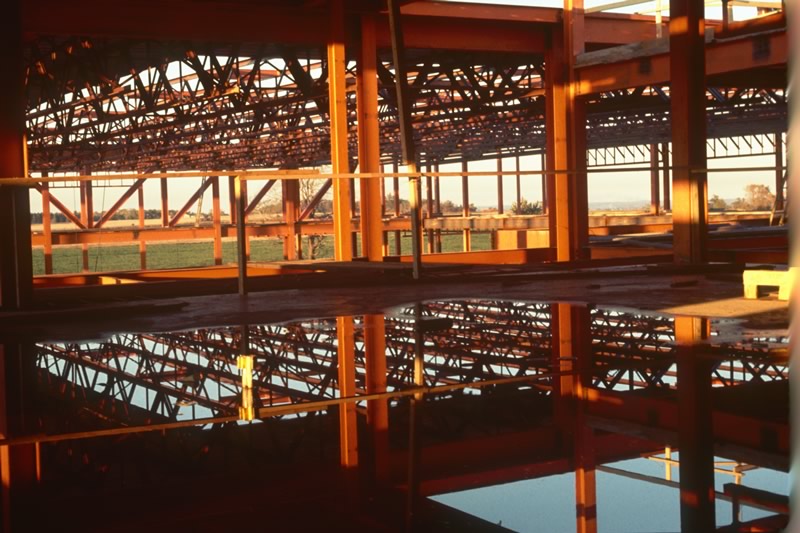 Construction images of Batavia campus building, framing, scaffolding.