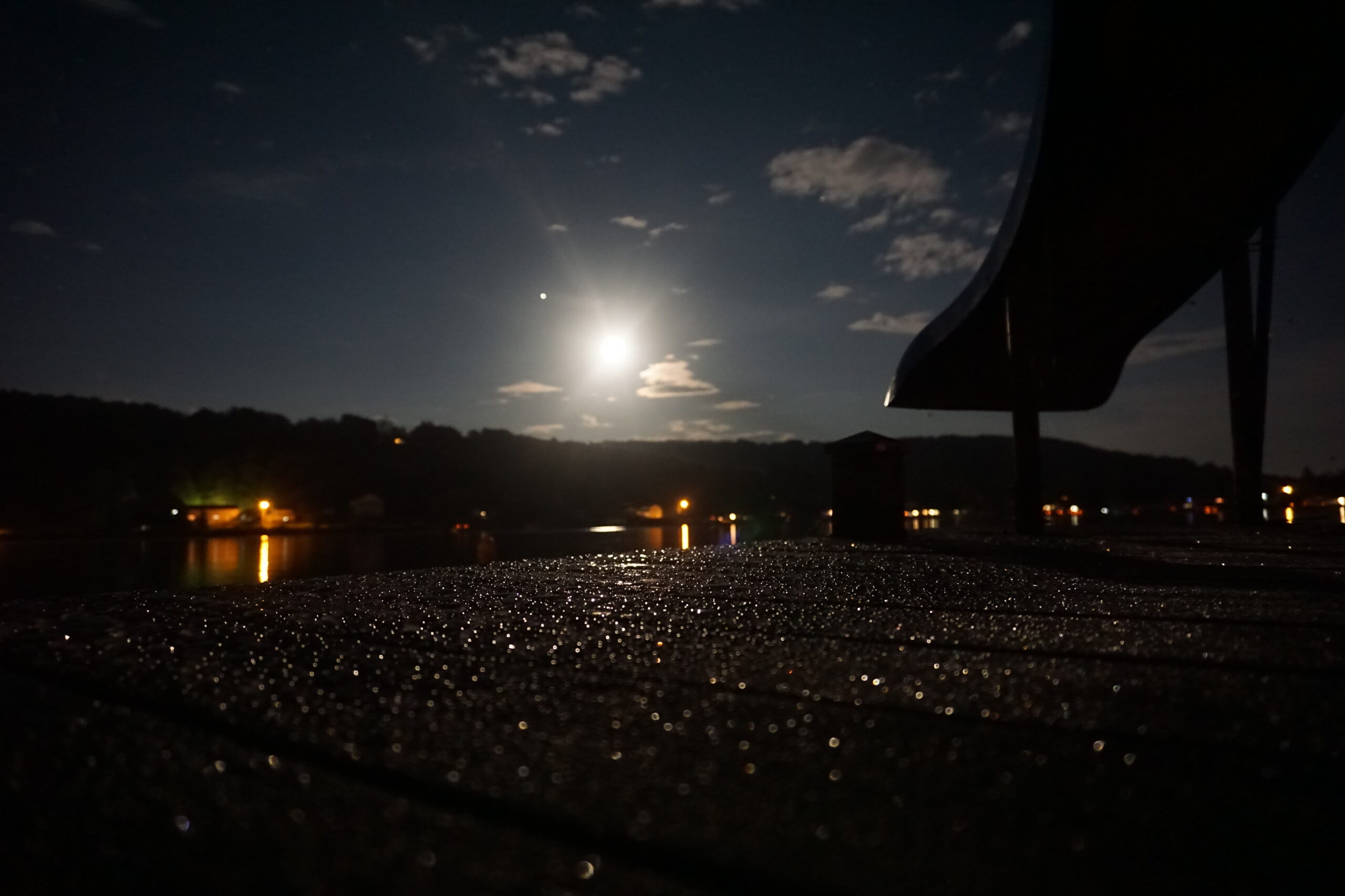 photo of slide at lakeside at night