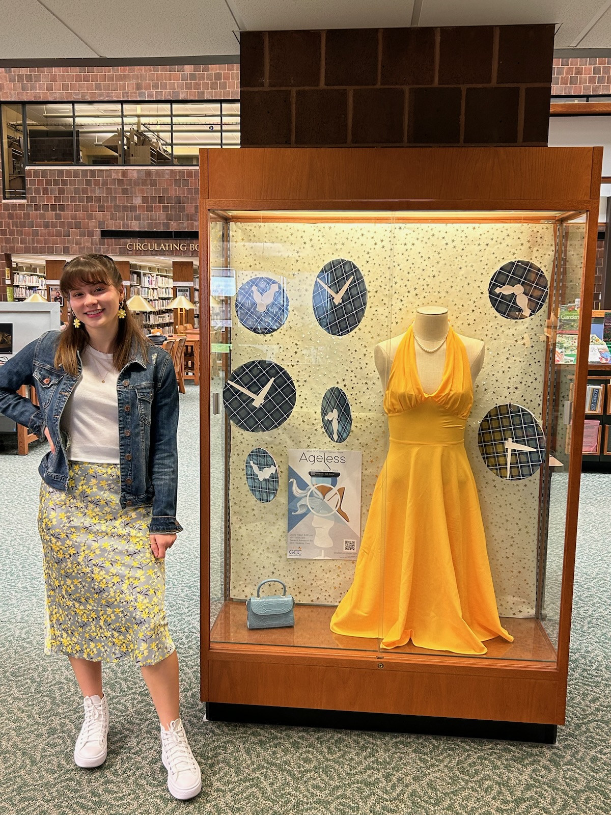 Fashion show display in library Genesee Community College