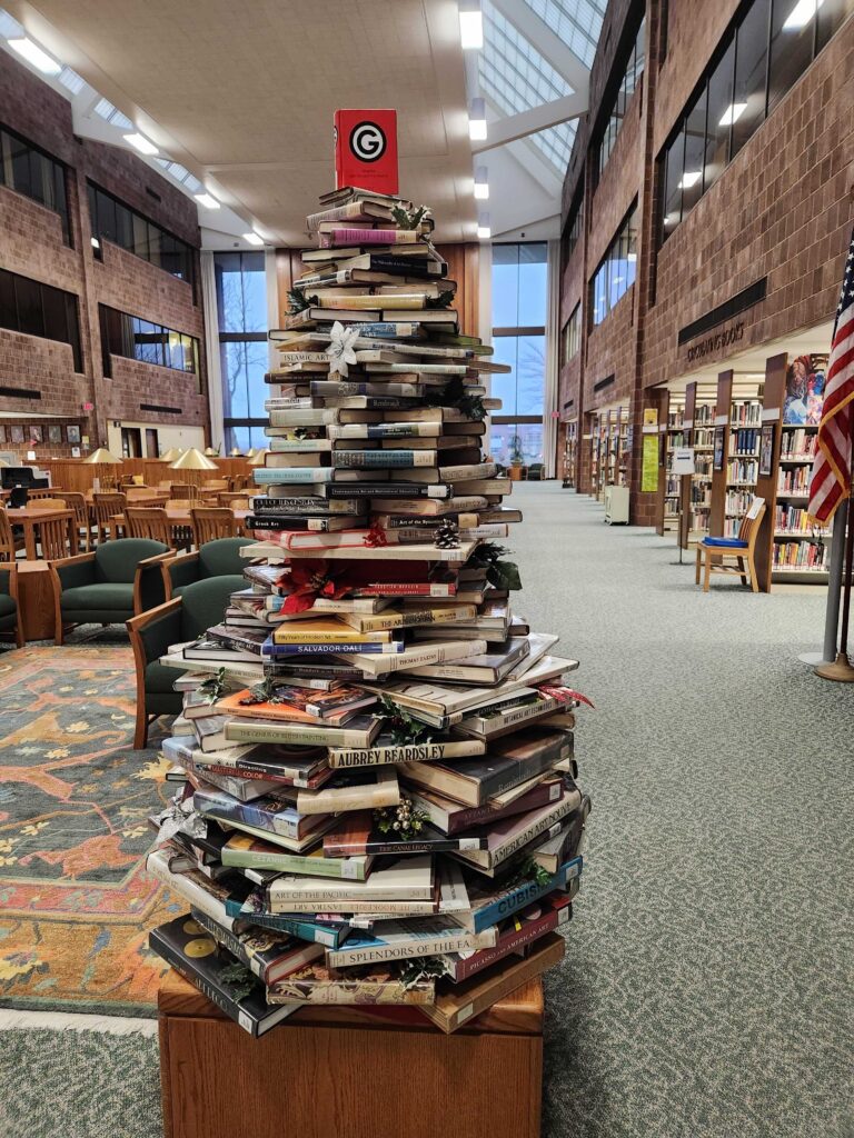 books stacked to resemble a Christmas tree