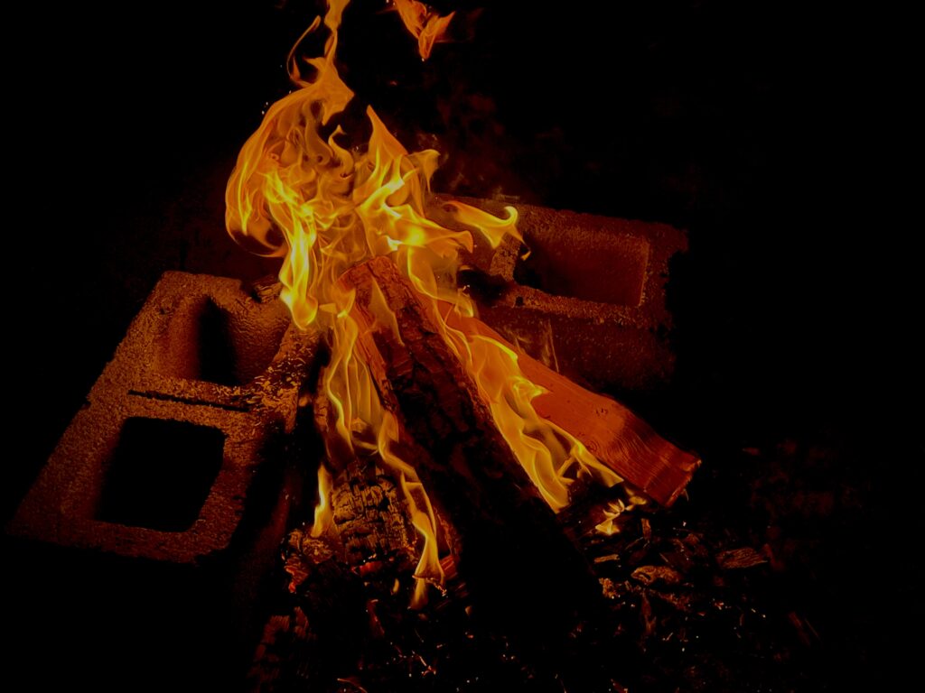 photo of campfire bordered by cinderblocks