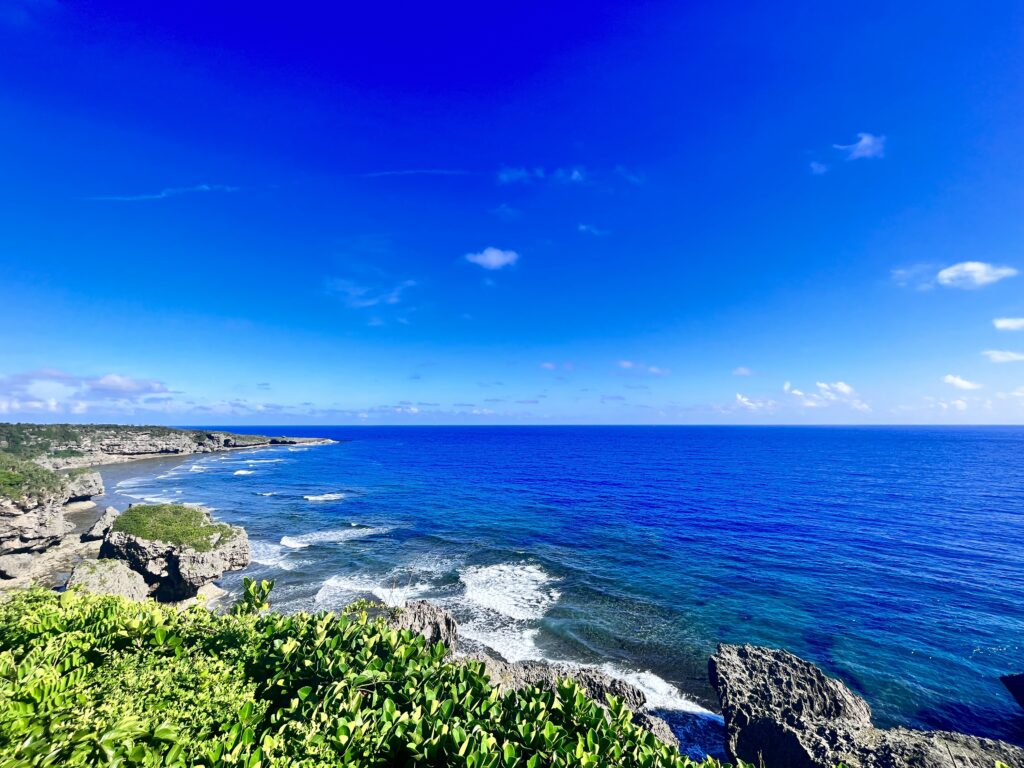 photo of very blue sky, coast, and very blue water