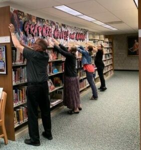 Rich Bartl, Liz Simmons, Cindy Francis, and Ashley Hankins installing new sign