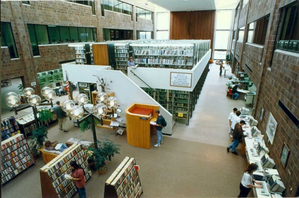GCC Library interior aerial picture showing old location for circulating books, new books, walk-up computers, etc.