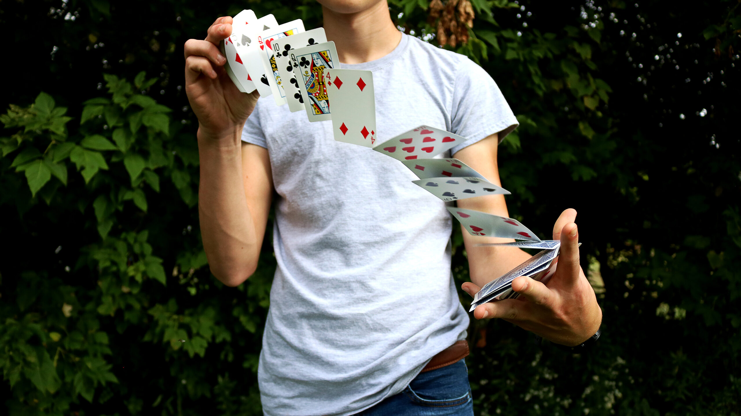 image of card deck being manipulated and appearing suspended in air