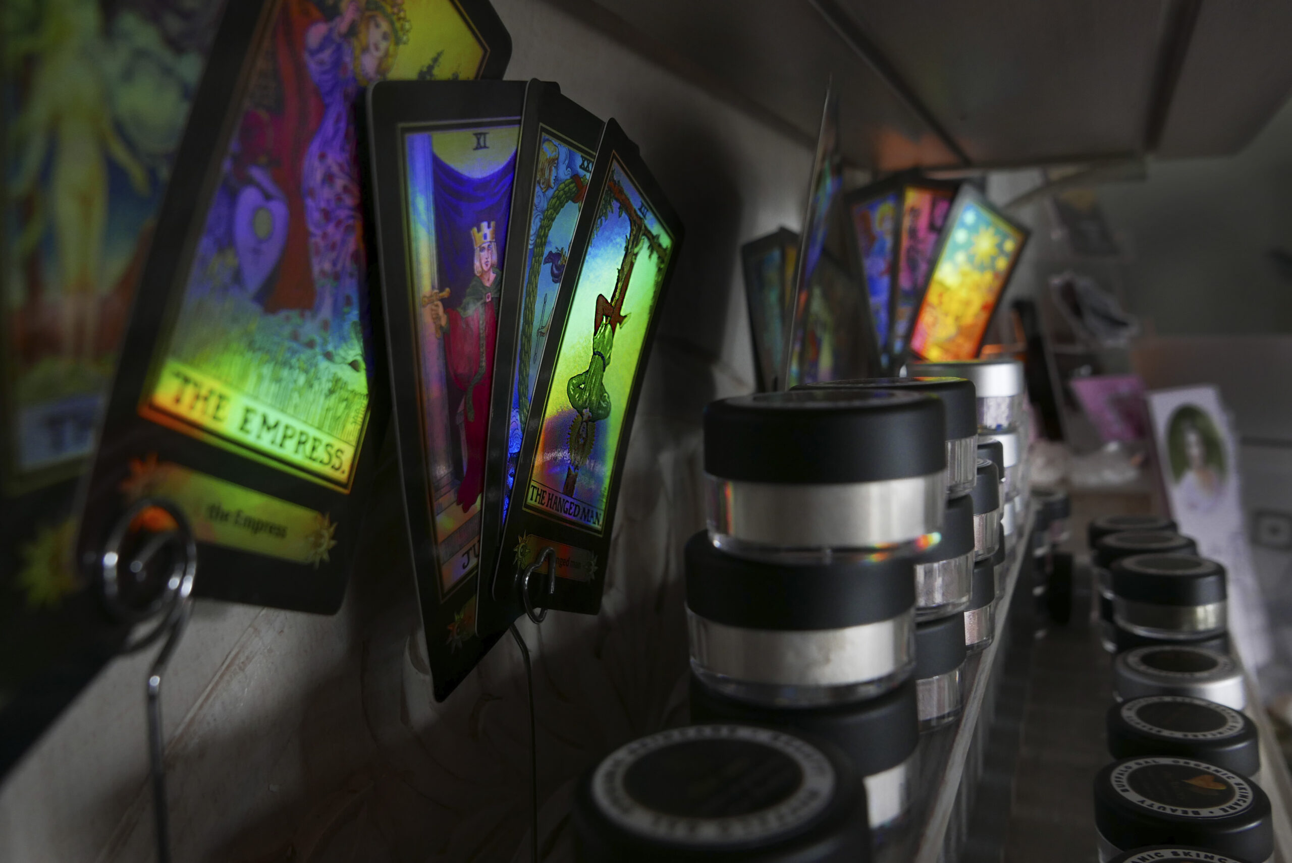 image of mostly black and white with tarot cards showing bright colors